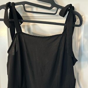 BCBG Paris Black pant jumpsuit. Strap ties and bow in back . Size 4-6 nwt